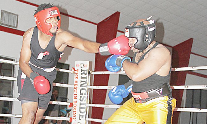 Anvin Sands, of the Bahamas, lands a punch against Nicoy Clarke, of the USA, during Saturday’s boxing show.
 