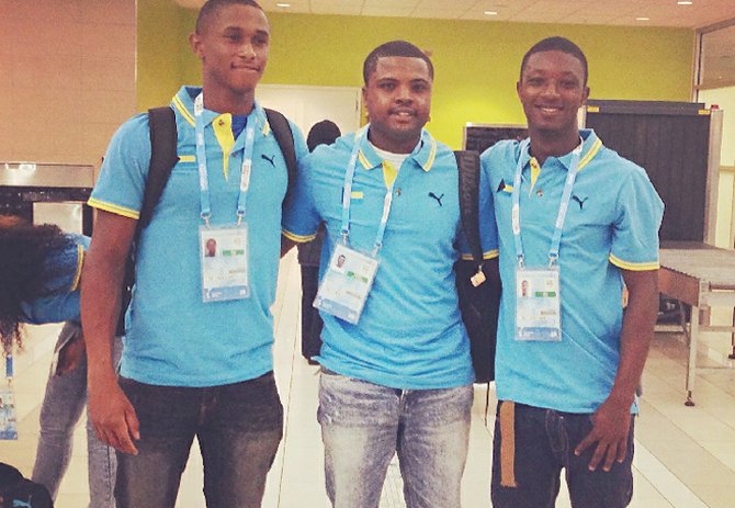YOUTH OLYMPIANS Justin Roberts (far left), Rasheed Carey and coach Ricardo Demeritte (centre) competed in the 2014 Youth Olympic Games in Nanjing, China.
