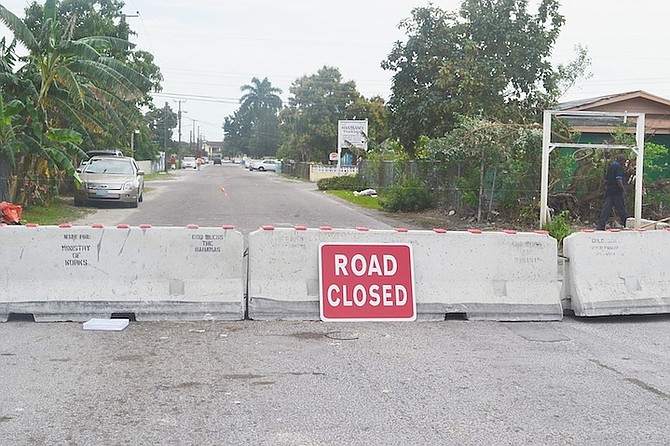 Barricades put in place to close Tucker Road, as part of the plan to develop the College of the Bahamas into a university. 