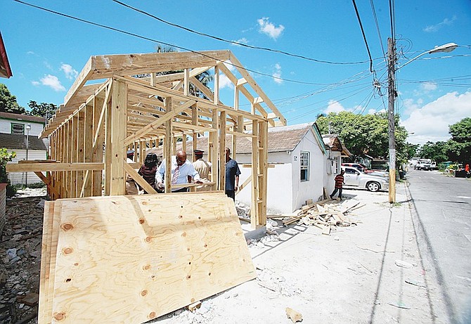 CONSTRUCTION under way in 2012 on a new home in Thompson Lane as part of Urban Renewal. 
