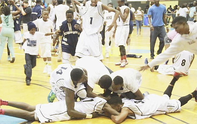 VICTORY SWEET: The CC Sweeting Cobras celebrate their 2nd consecutive Hugh Campbell Basketball Classic victory at the Kendal Isaacs Gymnasium.
