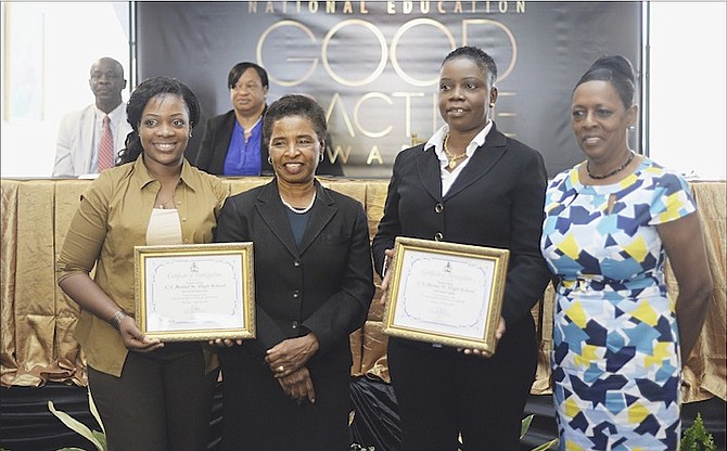 The Launch of the National Education Good Practice Awards yesterday. CV Bethel Senior High School representatives receive their award from Dr Pandora Johnson, of the College of the Bahamas. Photos: Shawn Hanna/Tribune Staff