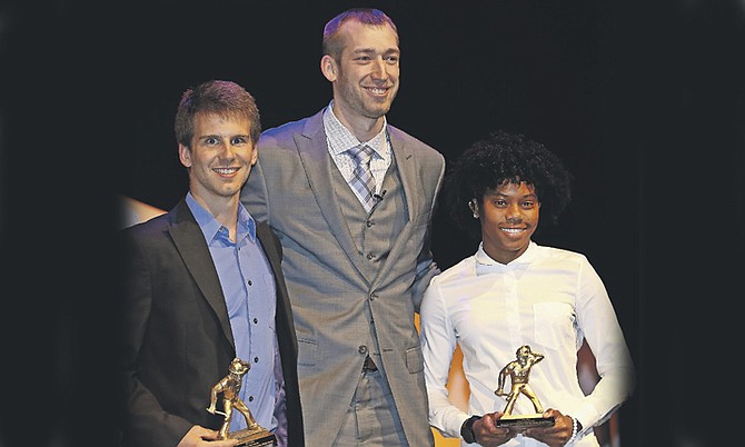 DEVYNNE CHARLTON (far right) receives her award with Matthew McClintock from Robbie Hummel, a former basketball star at Purdue University (centre).