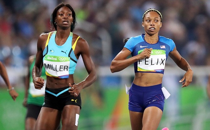 United States' Allyson Felix, right, and Bahamas' Shaunae Miller cross the finish line during their women's 400-metre semifinal. (AP)