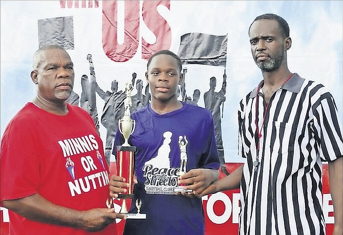 Presenting awards at the Marco City Free National Movement Association back-to-school basketball tournament. 