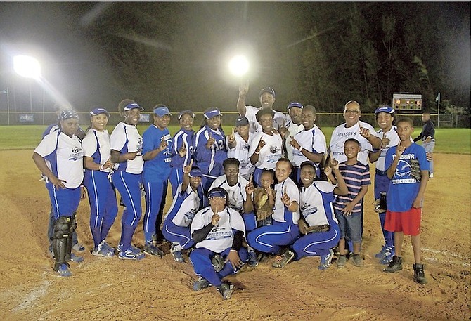 WE ARE THE CHAMPIONS: The Johnson’s Lady Truckers celebrate last night after routing the Folley’s Girls 18-6 in four innings via the 15-run mercy rule to win the ladies’ national title.
Photos: Tim Clarke/The Tribune