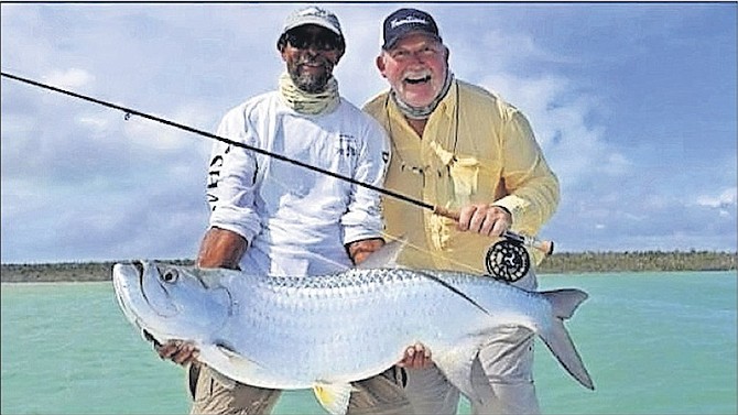 Local guide Shaky with a huge Tarpon in Crooked Island.
