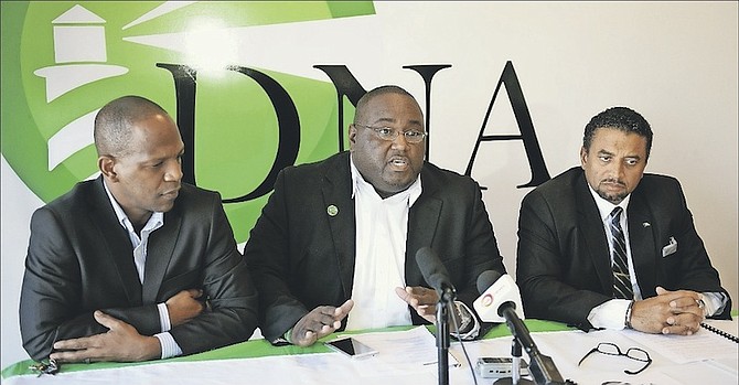 Youri Kemp, DNA candidate for Garden Hills, speaks at the party’s press conference on public service reform, flanked by leader Branville McCartney, right, and deputy leader Christopher Mortimer. Photo: Shawn Hanna/Tribune Staff