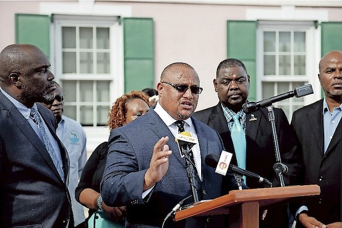 Greg Moss along with his team including Bahamas Public Services Union President John Pinder outside the House of Assembly yesterday. Photo: Shawn Hanna/Tribune Staff