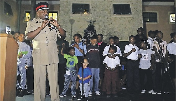 SENIOR assistant commissioner of Police Emrick Seymour on the stage with children during Wednesday night’s Christmas tree lighting ceremony, which was held at the Gerald Bartlett Police Complex in Freeport. Photo: Lisa Davis/BIS