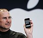 Apple CEO Steve Jobs holds up an iPhone …