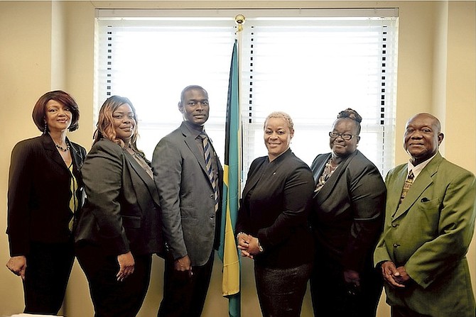 At the Department of Local Government’s induction ceremony for Family Island Administrators on Monday are (from left): Laverne Harris-Smith, administrator; Frances Hepburn-Symonette, inductee; Earl Campbell, inductee; Hope Strachan, Minister of Financial Services and Local Government; Smith Ingraham, inductee and Charles King, acting director, Department of Local Government. 
Photo: Shawn Hanna
