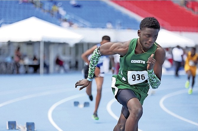 FAST TRACK: Students compete in the National High School Track and Field Championships yesterday at the Thomas A Robinson National Stadium.         
Photo: Terrel W Carey/Tribune Staff