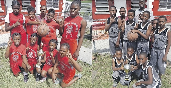 JOB WELL DONE: The Freedom Baptist Academy Warriors’ primary boys and girls and junior and senior girls basketball teams, during a special ceremony earlier this week outside their campus in Palmdale, were recognised for their achievements in the Father Marcian Peters Basketball Tournament, Akhepran Academy Basketball Jamboree, Bahamas Scholastic Athletic Association and the HOYTES Geneva Rutherford Basketball Classic in Grand Bahama.
