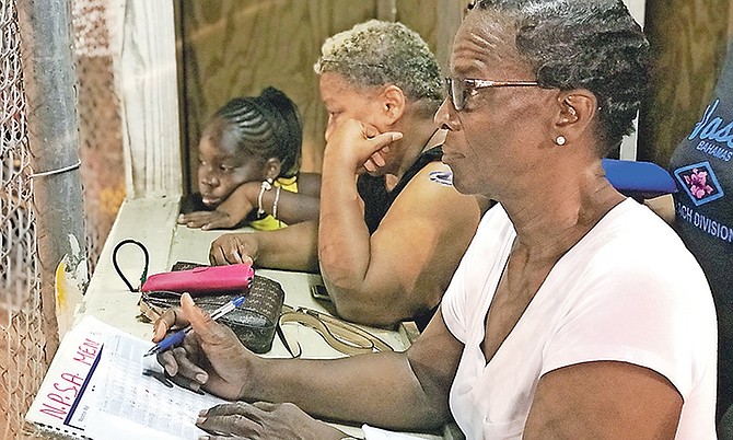 Rozina Taylor keeping score in the booth. Photo: Terrel W. Carey/Tribune Staff