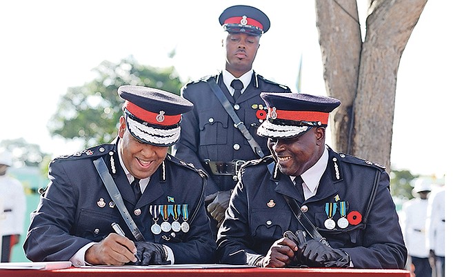 The new Commissioner of Police Anthony Ferguson and former Commissioner of Police Ellison Greenslade pictured during Monday’s ceremony. Photo: Shawn Hanna/Tribune Staff
