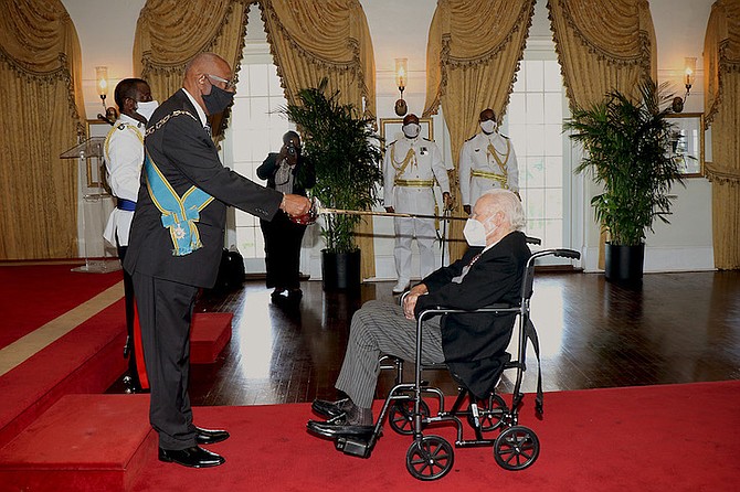 Godfrey Kenneth Kelly received a knighthood during an Investiture Ceremony held at Government House on Monday, conducted by Governor General Sir Cornelius A. Smith. (BIS Photo/Letisha Henderson).