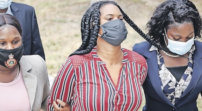 LADERIA Russell outside court yesterday. She denied a number of charges - and is accused of 160 charges in total relating to forged documents in connection with people attempting to travel using
fake COVID-19 test results. Photo: Racardo Thomas