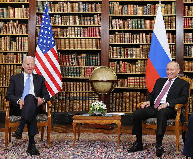 U.S. President Joe Biden, left, and Russia’s President Vladimir Putin, right, pose for the media at
Villa La Grange for the U.S.-Russia summit in Geneva, Switzerland, Wednesday. (Denis Balibouse/
Pool Photo via AP)