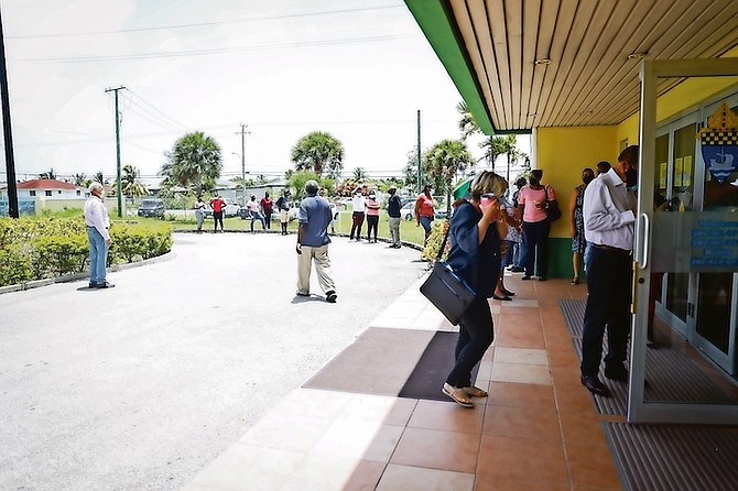 PEOPLE in line at the COVID-19 vaccination site at Loyola Hall yesterday. 
Photo: Racardo Thomas/Tribune Staff