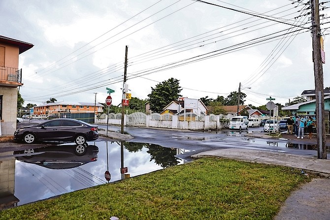 POLICE on the scene of a fatal shooting at Quintine Alley off Wulff Road.
Photo: Racardo Thomas/Tribune Staff