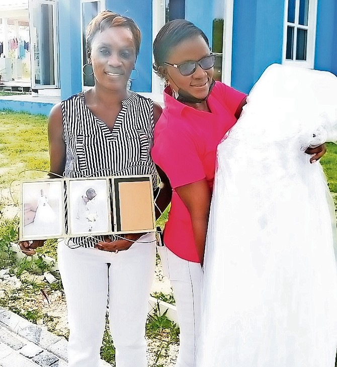 WHEN Hurricane Dorian battered Grand Bahama, East End resident Maydon Cooper Swann, left,
found her wedding dress after the storm covered in dirt, torn and tattered. Yesterday, she was
reunited with the dress, restored and, as she said, “snow white”.