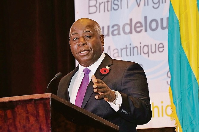 PRIME Minister and Minister of Finance Philip Davis speaks during the opening of the 10th Anniversary Edition of the Caribbean Hotel Investment Conference and Operations Summit (CHICOS) at Baha Mar. 
(BIS Photos / Eric Rose)