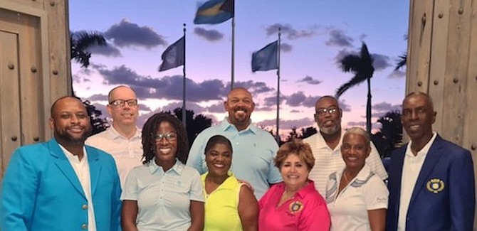 LYNFORD MILLER, far left, and his entire slate of officers were re-elected for a second straight two-year team as executives of the Bahamas Golf Federation.