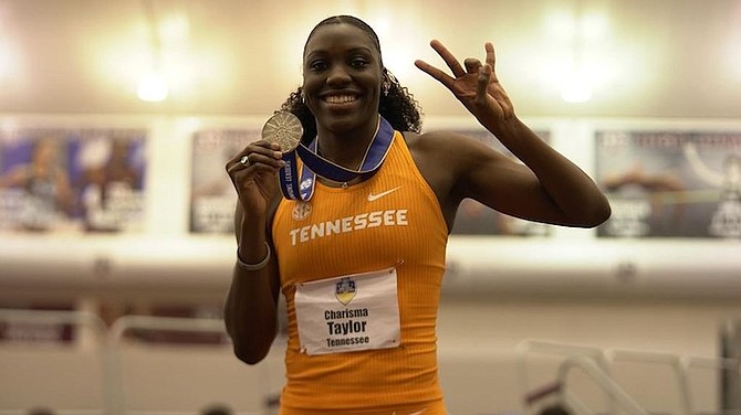 CHARISMA Taylor shows off her medal.