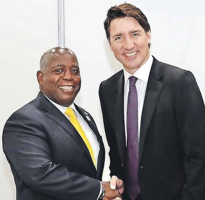 PRIME Minister Philip “Brave” Davis with Canadian Prime Minister Justin Trudeau.