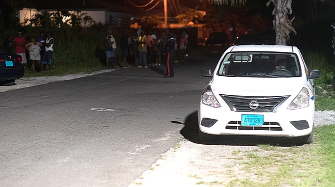 Police at the scene of the shooting on Tuesday night.
Photo: Moise Amisial