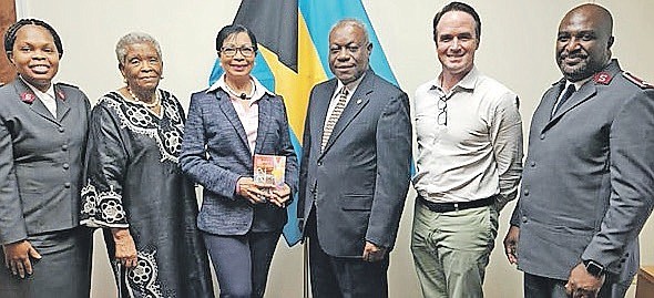 Ann Marie Davis with representatives from the Salvation Army. Mrs Davis is pictured holding the Salvation Army’s Yearbook. Pictured from left, Aldene Meo, divisional director of women’s ministries; Judy Munroe, emeritus chairman, Salvation Army advisory board; Mrs Davis; Felix Stubbs, chairman, Salvation Army advisory board; Cameron Symonette, advisory board member; Roodolph Meo, divisional commander.