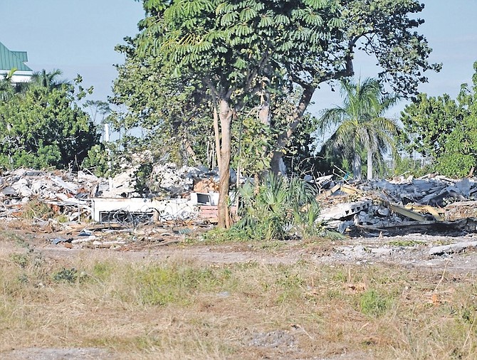 THE WINDSOR on the Mall apartment complex, where several people were living, was recently demolished in Freeport. The Harold DeGregory Government Complex, where the Office of the Prime Minister is located, is seen in the background.