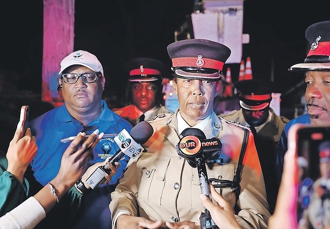 POLICE press liason Chrislyn Skippings alongside Keno Wong, chairman of the Bahamas National Neighbourhood Watch Council, on Tuesday. Photo: Austin Fernander