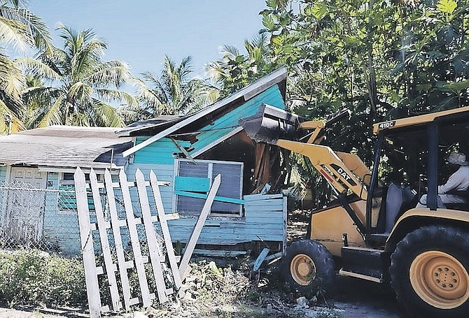 A DILAPIDATED home was demolished by Urban Renewal yesterday as a preventive measure against criminal activity in the Bain and Grants Town area.
Photos: Austin Fernander