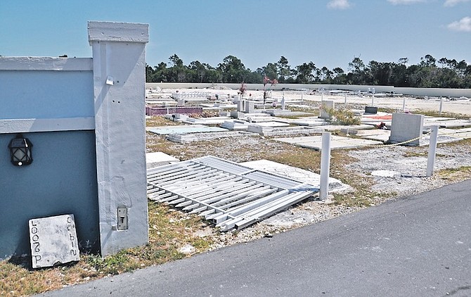 A fallen gate at the entrance to the Eight Mile Rock cemetery.