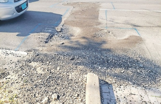 IN this picture supplied by a reader, a damaged road section which was reported on March 21 has seen no action to remedy the hazardous roadway on Shirley Street. The location, just befors Moss Lane, was reportedly dug up by the Water & Sewerage Corporation on March 19.