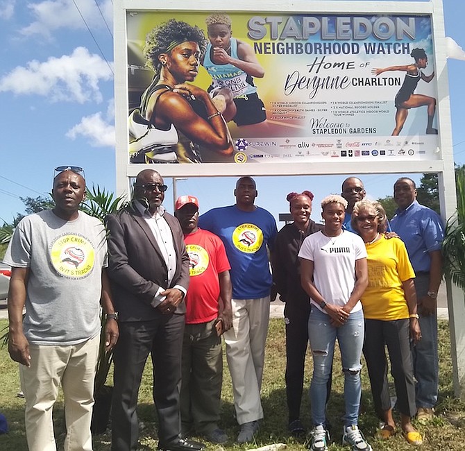 MINISTER of Youth, Sports and Culture Mario Bowleg joins community leaders and family of Devynne Charlton for the unveiling.