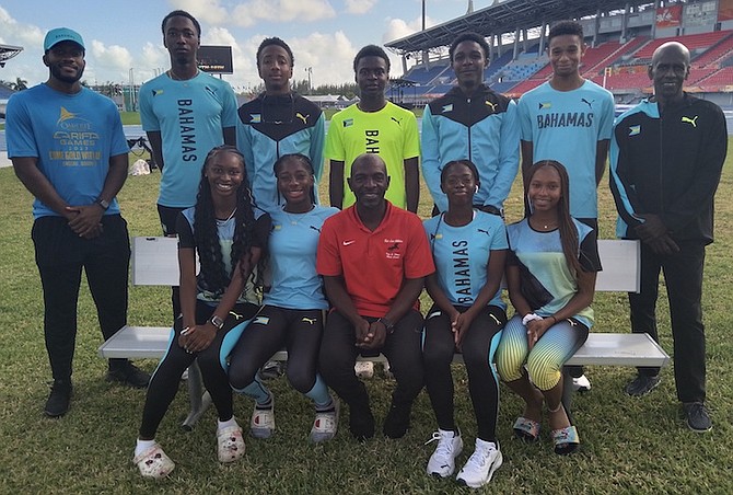 Members of the Red-Line Athletics team pose with some of their coaches.