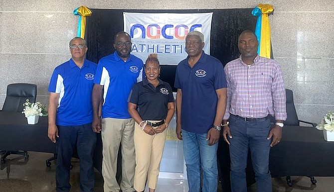 SHOWN, from left to right, are Trevor Moss, meet director Demarius Cash, NACAC administrator Nikita Thompson, NACAC president Mike Sands and Drumeco Archer, president of the BAAA.