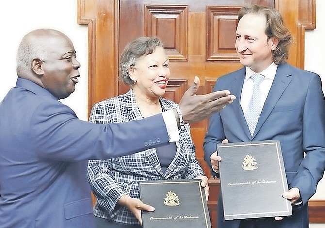 PRIME Minister Philip ‘Brave’ Davis with Nicole Campbell, Secretary to the Cabinet, and William Pizzorni of Legendary Marina Resort after the signing of a $110m MOU.
Photo: Austin Fernander