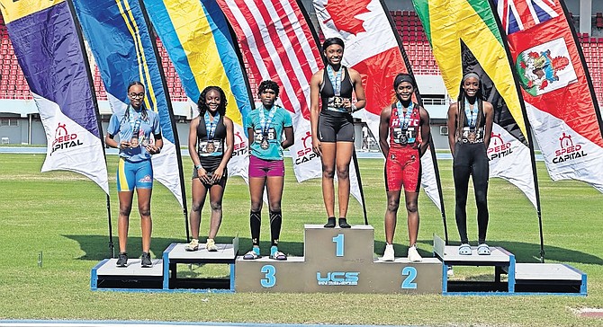 Nia Richards, of Star Elite Athletics Bahamas, receives gold after winning the 17 and 18 year olds 200m finals.