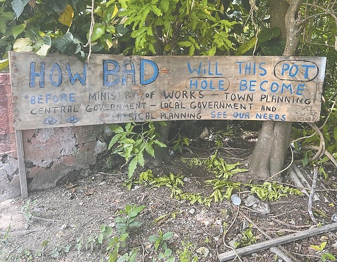 A SIGN asking how bad a pothole will become in Eleuthera.
Photos: Earyel Bowleg