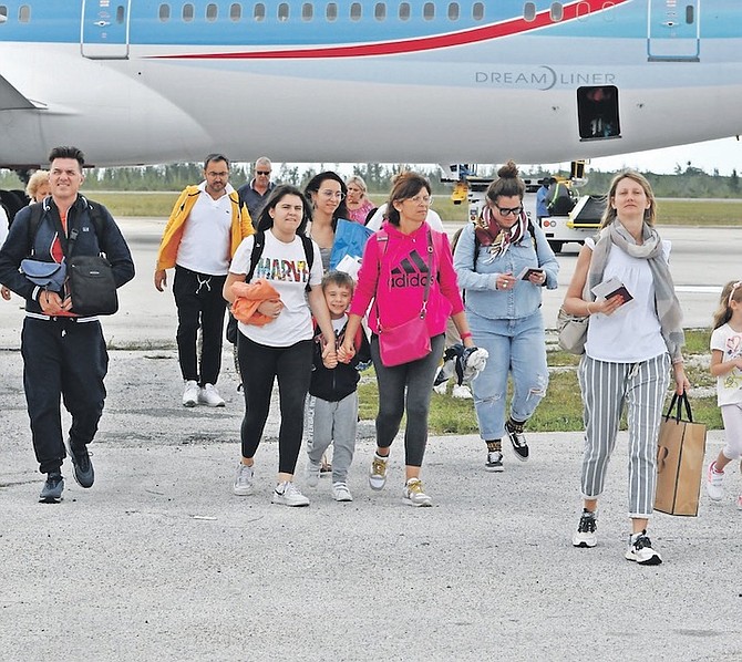 PASSENGERS disembarking from the NEOS flight to Grand Bahama.
Photo: Vandyke Hepburn