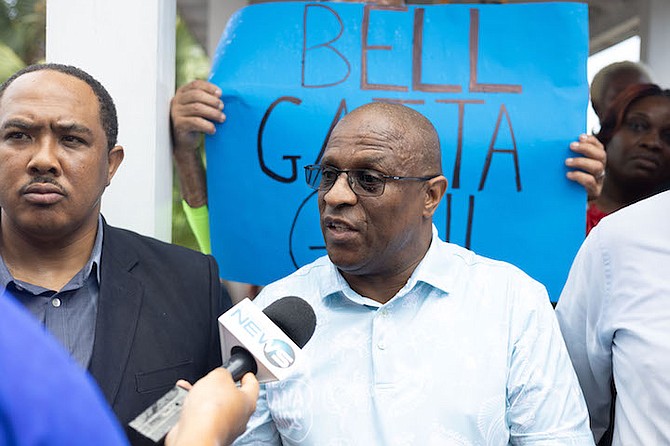 FREE National Movement Leader Michael Pintard demanded that Prime Minister Philip “Brave” Davis answer questions about Immigration Minister Keith Bell’s decision to grant citizenship to three people at a funeral. He spoke to reporters yesterday as more than 25 FNM supporters stood on the steps of the Immigration Department in protest of Bell’s actions.
Photos: Moise Amisial