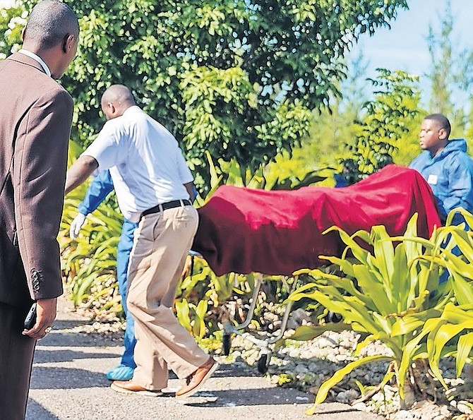 THE BODY of Garath Pyfrom is taken from the scene where it was found off Marshall Road.
Photo: Austin Fernander