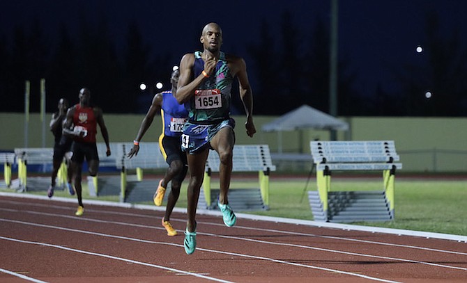 CRUISE CONTROL - Steven Gardiner cruises to victory yesterday in the 400 metre finals on day two of Bahamas Association of Athletic Associations’ Junior & Senior National Track and Field Championships at the original Thomas A Robinson stadium. 
Photo: Austin Fernander/Tribune Staff