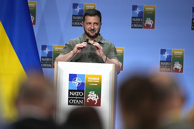 Ukraine’s President Volodymyr Zelenskyy addresses a media conference at a NATO summit in Vilnius, Lithuania yesterday. The United States and other major industrialized nations are pledging long-term security assistance for Ukraine as it continues to fight Russia’s invasion. 
Photo: Pavel Golovkin/AP