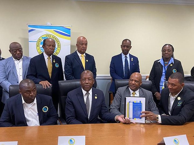 Works and Utilities Minister Alfred Sears and Minister of Labour Keith Bell, along with other WSC executives at the Water and Sewerage Corporation industrial agreement signing with the Water and Sewerage management Union (WSMU).
Photo: Jade Russell