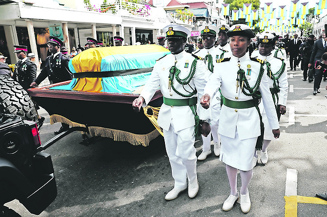 Royal Bahamas Police Force (RBPF) and Royal Bahamas Defence Force (RBDF) officers march with Obie Wilchcombe’s casket during the state funeral yesterday. 
Photos: Dante Carrer